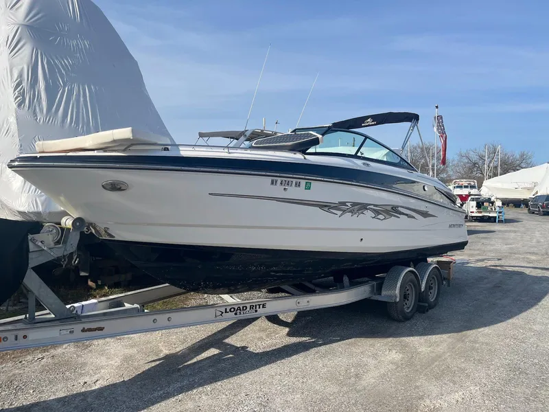 Slide: The Image of 2015 Monterey 264FSX boat on trailer, parked outdoors, side view. - 0