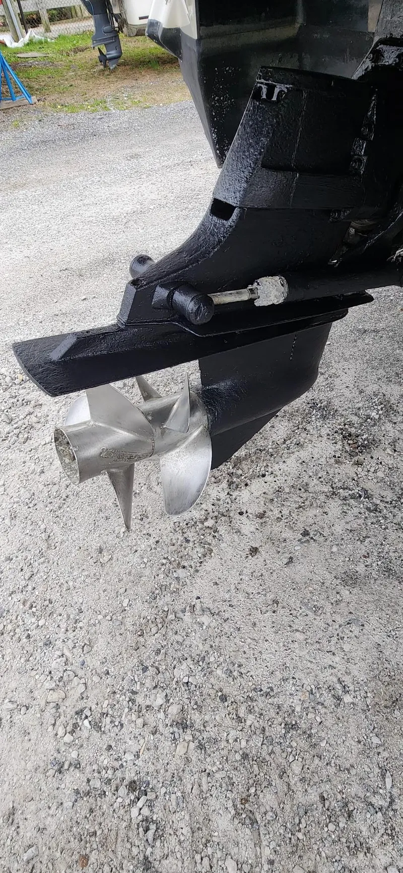 Slide: The Image of Close-up of a 2015 Monterey 264FSX boat propeller on gravel surface. - 16