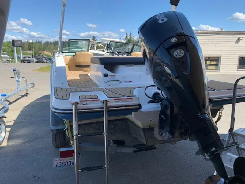 Slide: The Image of 2022 Sea Ray SPX 190 OB boat with outboard motor, parked outdoors. - 5