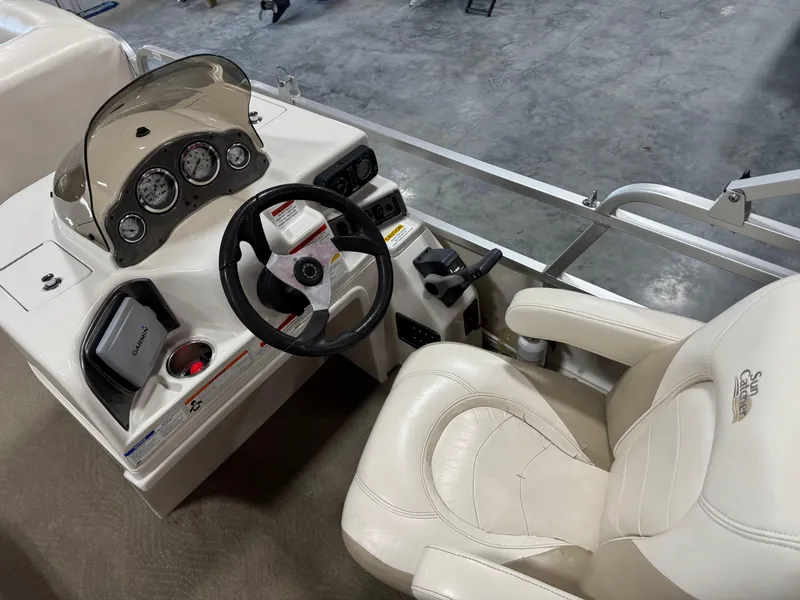 Slide: The Image of 2008 G3 LX 26C boat cockpit with steering wheel and control panel. - 11