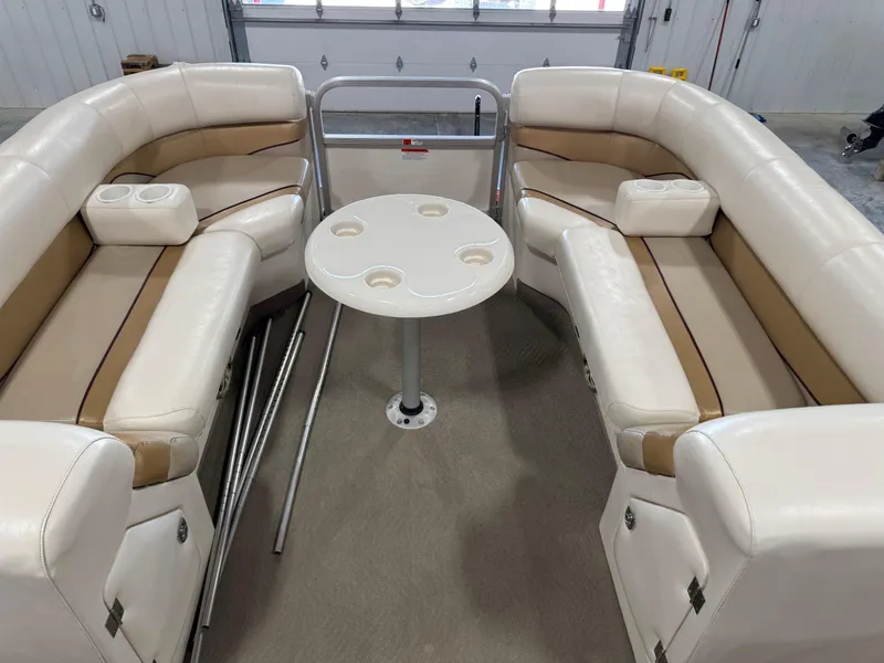 Slide: The Image of 2008 G3 LX 26C boat interior with beige seating and round table. - 12