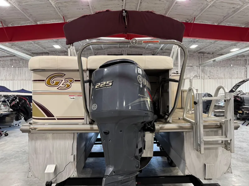 Slide: The Image of 2008 G3 LX 26C pontoon boat with Yamaha 225 outboard motor in a showroom. - 5