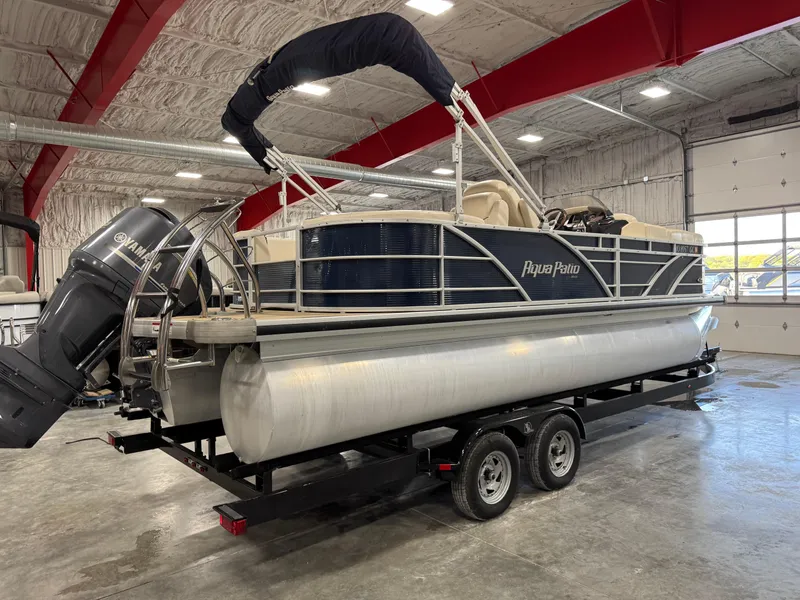Slide: The Image of 2016 AquaPatio 220 AD pontoon boat on trailer in indoor storage facility. - 3