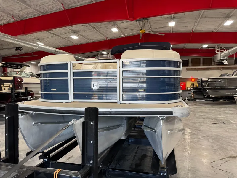 Slide: The Image of 2016 AquaPatio 220 AD pontoon boat in indoor showroom with red ceiling. - 4