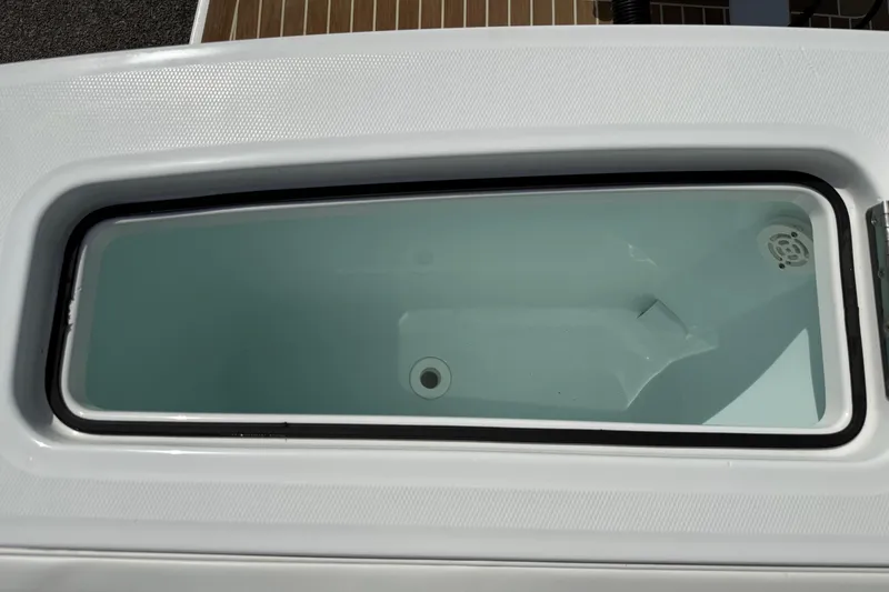 Slide: The Image of Livewell on a 2016 Regulator 23 boat, featuring a clean, spacious interior. - 26