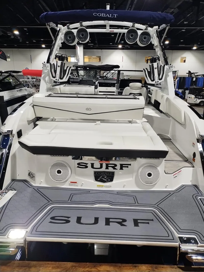 Slide: The Image of 2025 Cobalt R6 Surf boat with sleek design and advanced audio system. - 12
