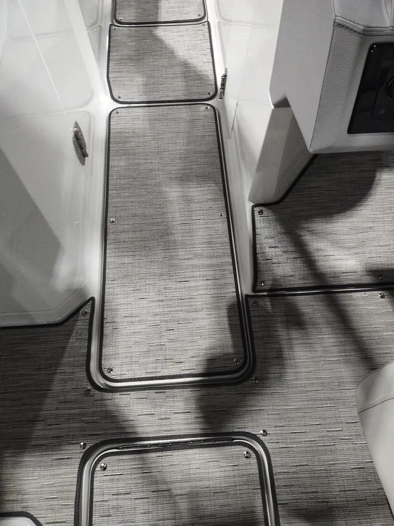 Slide: The Image of 2025 Cobalt R6 Surf boat interior with sleek, modern flooring design. - 21