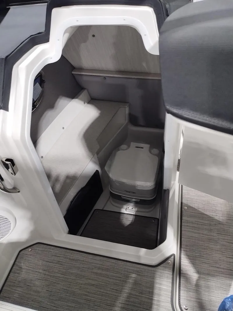 Slide: The Image of 2025 Cobalt R6 Surf boat interior with compact toilet and modern design. - 4