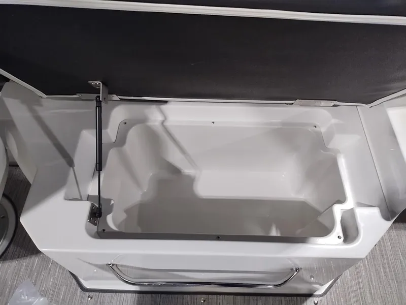 Slide: The Image of Open storage compartment in 2025 Cobalt R6 Surf boat interior. - 5