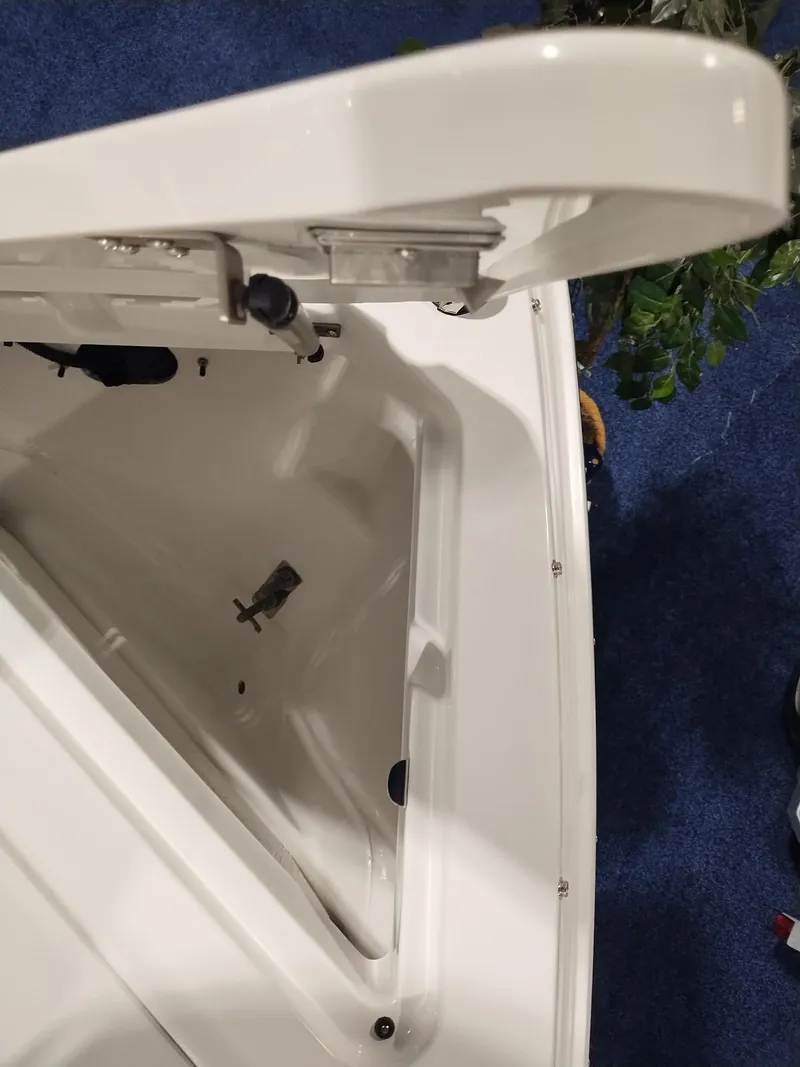 Slide: The Image of Open storage compartment of 2025 Cobalt R6 Surf boat, showcasing interior details. - 6