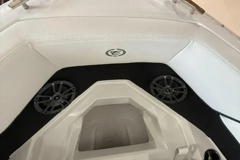 Slide: The Image of 2025 Cobalt CS22 boat interior with white seating and built-in speakers. - 11