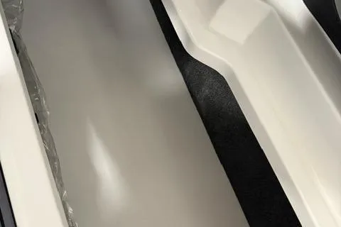 Slide: The Image of 2025 Cobalt CS22 interior storage compartment, featuring sleek white and black design. - 19