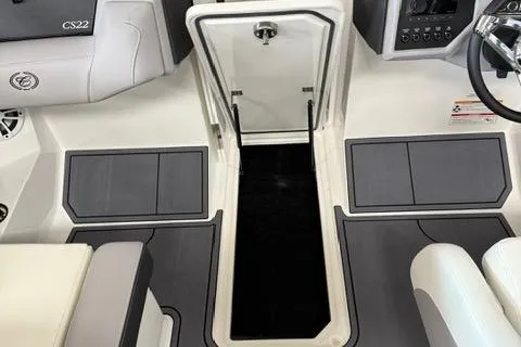 Slide: The Image of 2025 Cobalt CS22 boat interior with storage compartment and seating. - 20
