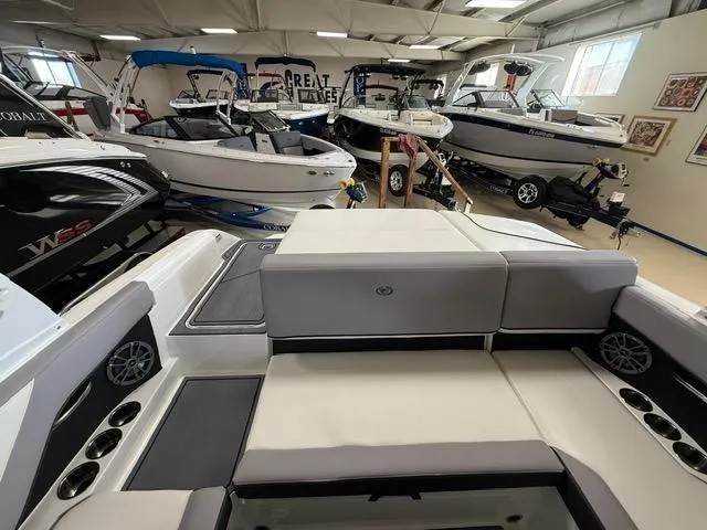 Slide: The Image of Showroom with 2025 Cobalt CS22 boats, featuring sleek design and modern interiors. - 5