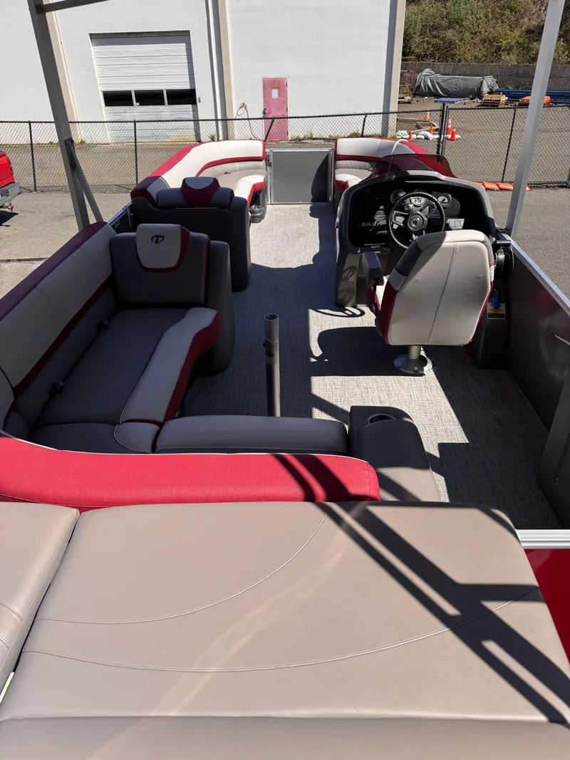 Slide: The Image of 2023 Tahoe Pontoon Cascade Cruise Funship interior with red and gray seating, steering console. - 10