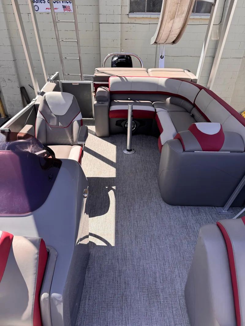 Slide: The Image of 2023 Tahoe Pontoon Cascade Cruise Funship interior with gray and red seating. - 11