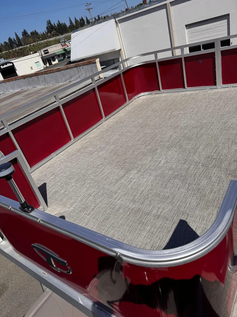 Slide: The Image of 2023 Tahoe Pontoon Cascade Cruise Funship with red railing and spacious deck. - 7