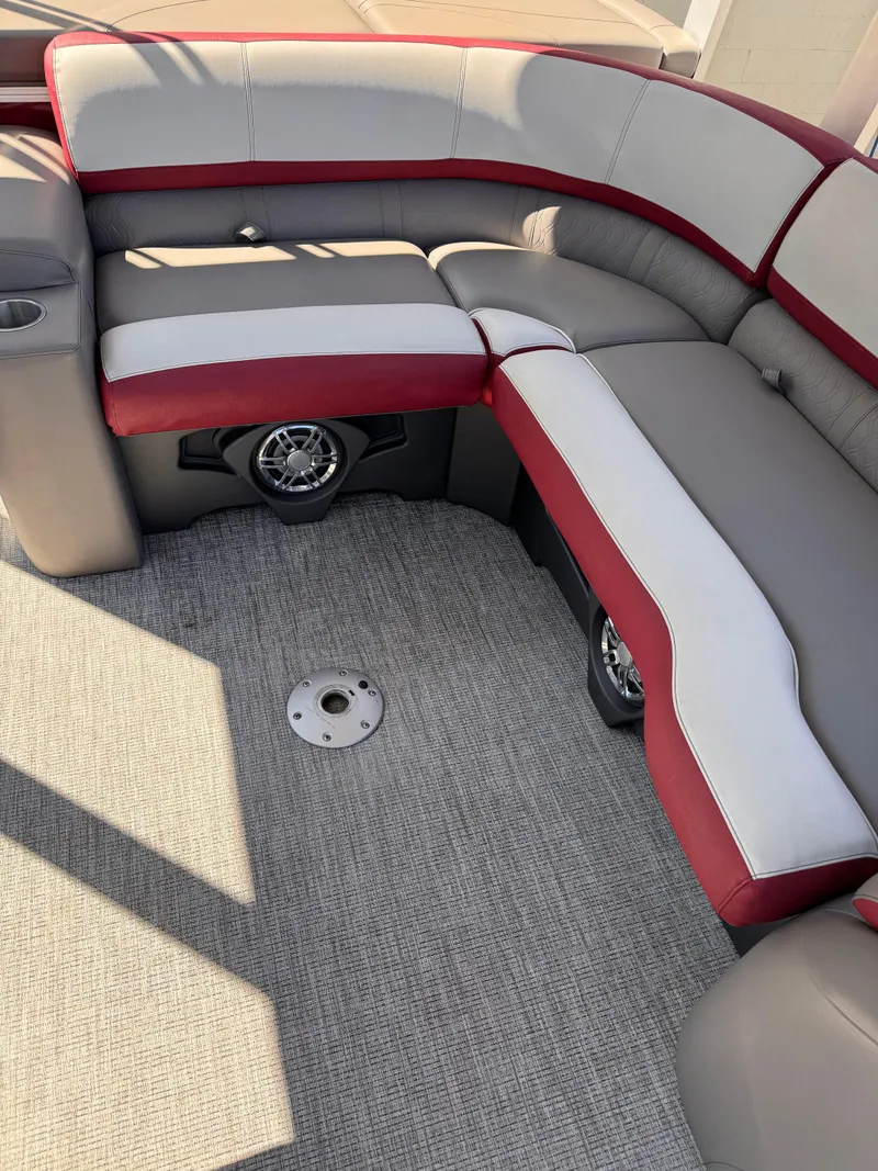 Slide: The Image of 2023 Tahoe Pontoon Cascade Cruise Funship interior with red and gray seating. - 8