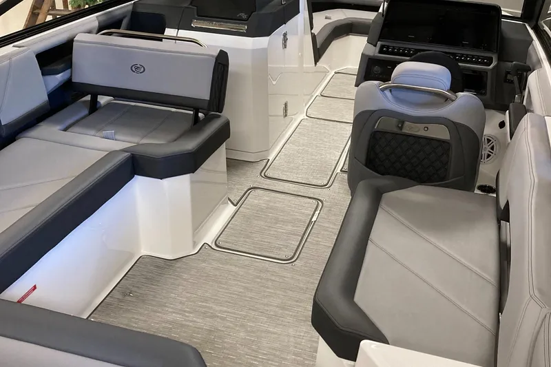Slide: The Image of 2025 Cobalt R6 boat interior with modern seating and sleek design. - 11