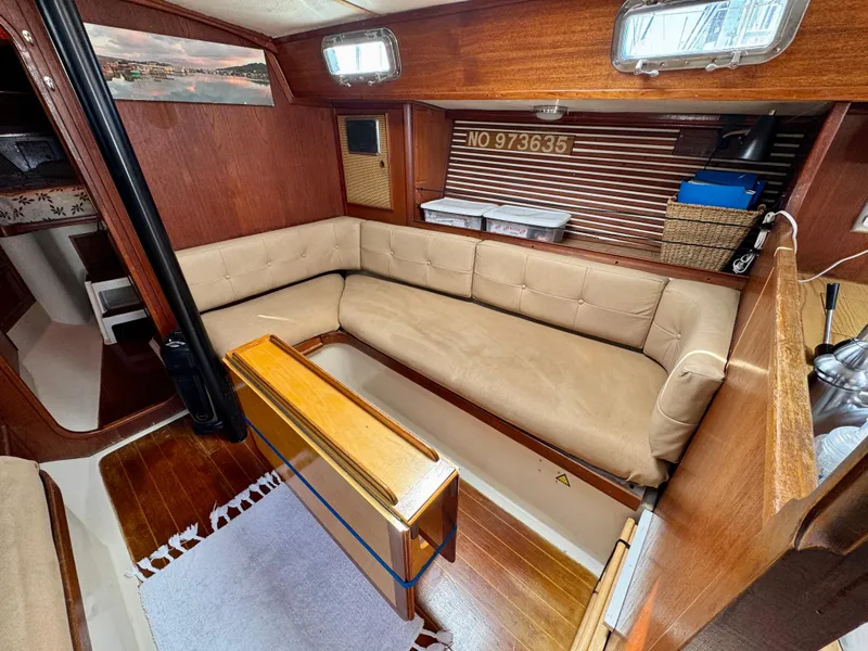 Slide: The Image of 1979 Irwin Citation 39 yacht interior with cozy seating and wooden accents. - 12