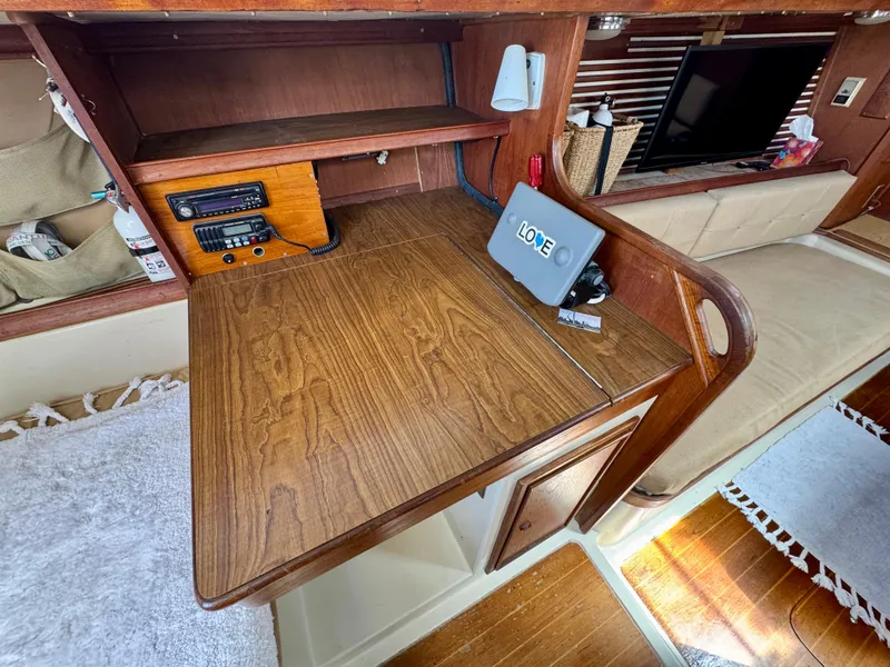 Slide: The Image of 1979 Irwin Citation 39 interior with wooden desk, radio, and seating area. - 16