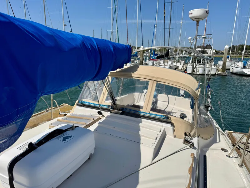 Slide: The Image of 1979 Irwin Citation 39 sailboat docked in marina, featuring blue sail cover. - 17
