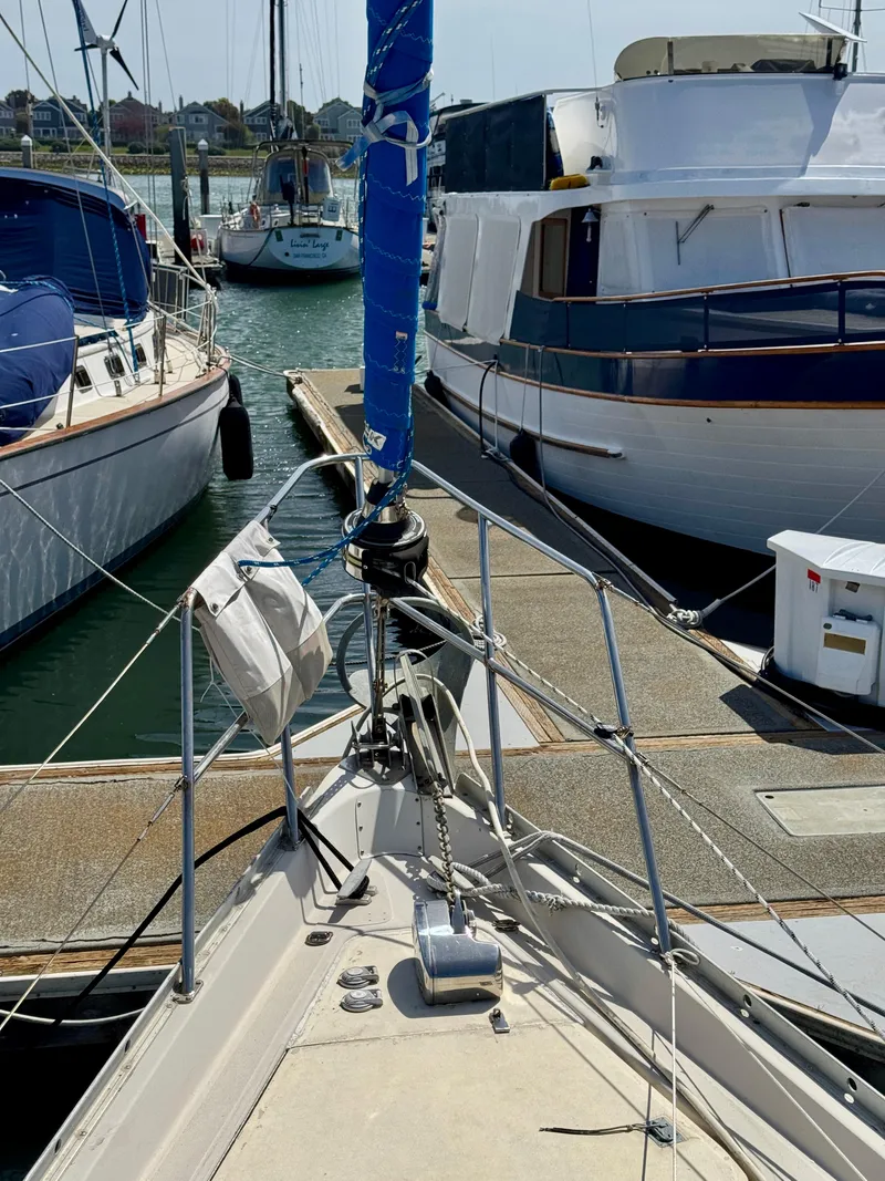 Slide: The Image of 1979 Irwin Citation 39 sailboat docked at a marina, surrounded by other boats. - 18