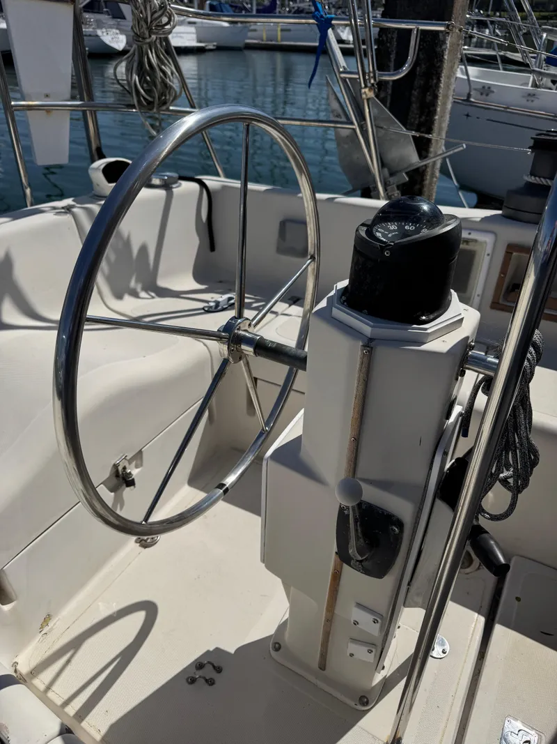 Slide: The Image of 1979 Irwin Citation 39 sailboat cockpit with steering wheel and navigation equipment. - 19
