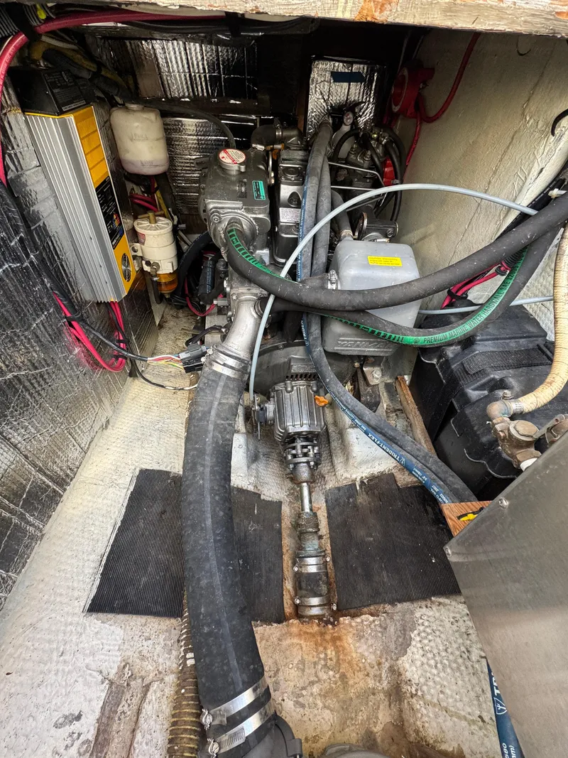 Slide: The Image of Engine compartment of a 1979 Irwin Citation 39 sailboat, showing mechanical components and wiring. - 22