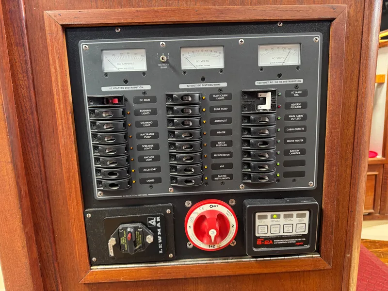 Slide: The Image of Electrical panel on a 1979 Irwin Citation 39 sailboat, featuring switches and gauges. - 26