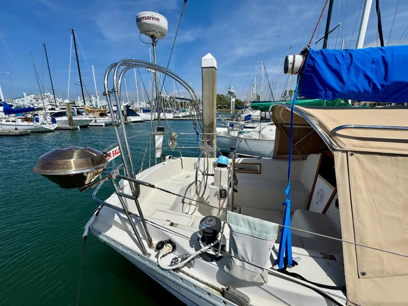 Slide: The Image of 1979 Irwin Citation 39 sailboat docked in marina, featuring a spacious cockpit and nautical equipment. - 4