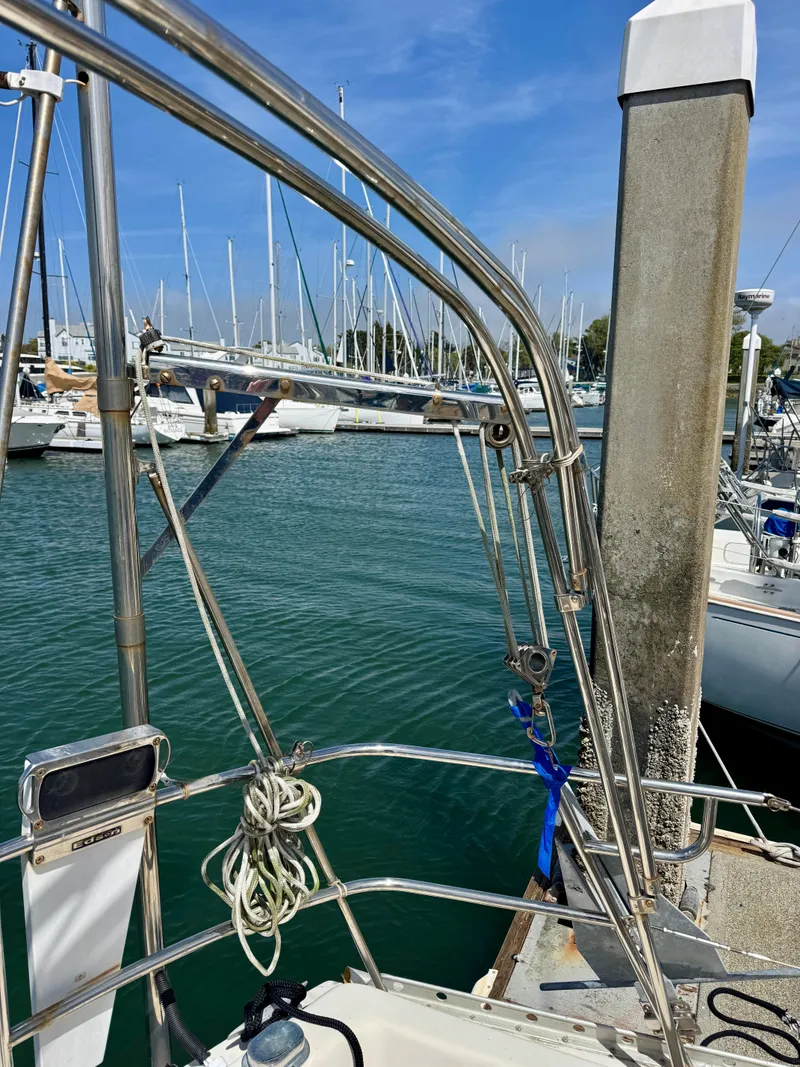 Slide: The Image of 1979 Irwin Citation 39 sailboat docked at marina with clear blue sky. - 6