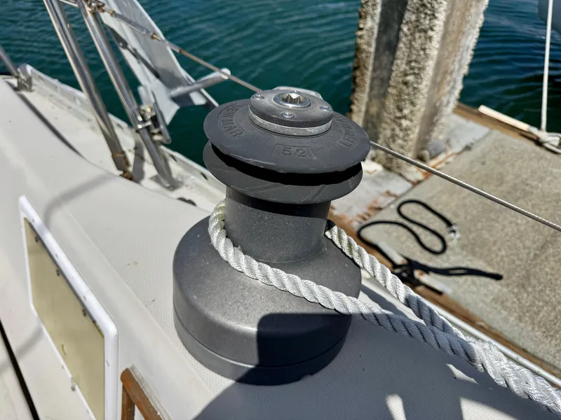Slide: The Image of Winch on 1979 Irwin Citation 39 sailboat deck, with rope and water background. - 7