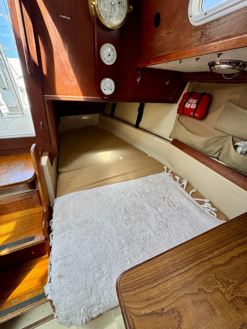 Slide: The Image of 1979 Irwin Citation 39 cabin interior with cozy sleeping area and nautical decor. - 9