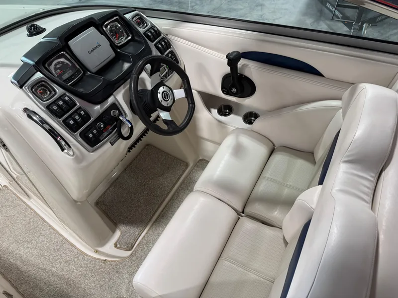 Slide: The Image of 2009 Chaparral 276 SSX boat interior with steering wheel and control panel. - 14