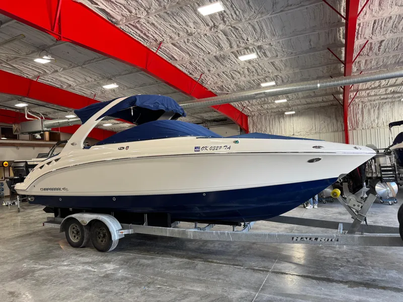 Slide: The Image of 2009 Chaparral 276 SSX boat on trailer in indoor storage facility. - 18
