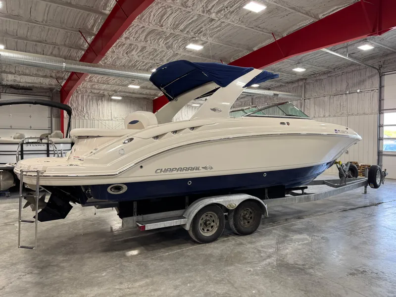 Slide: The Image of 2009 Chaparral 276 SSX boat on trailer in indoor storage facility. - 3