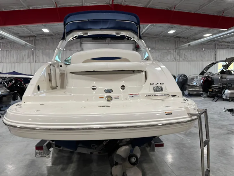 Slide: The Image of 2009 Chaparral 276 SSX boat in indoor storage, rear view. - 5