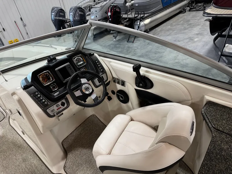 Slide: The Image of 2008 Chaparral Sunesta 284 boat cockpit with steering wheel and control panel. - 10