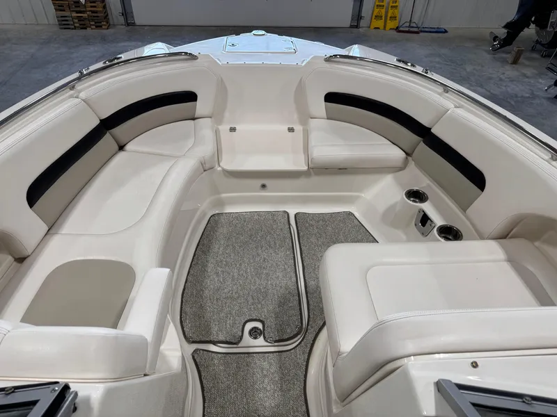 Slide: The Image of 2008 Chaparral Sunesta 284 boat interior with white seating and gray carpet. - 8