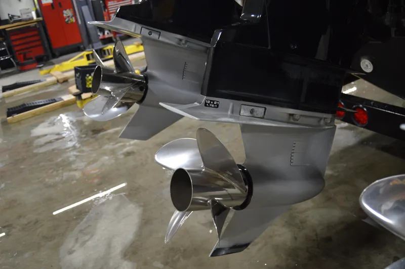 Slide: The Image of Dual propellers of a 2017 Statement 380 Open boat in a workshop setting. - 10