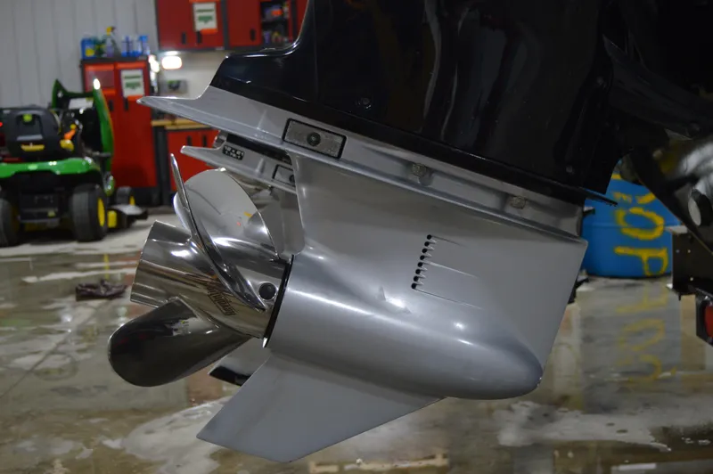 Slide: The Image of Outboard motor propeller of a 2017 Statement 380 Open boat in a workshop setting. - 11