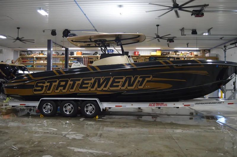 Slide: The Image of 2017 Statement 380 Open boat on trailer in indoor storage facility. - 15