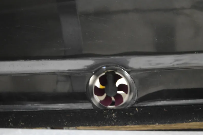 Slide: The Image of Close-up of a 2017 Statement 380 Open boat detail, featuring a circular metal component. - 17