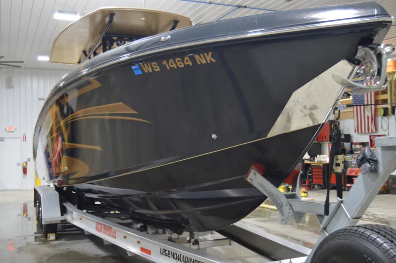 Slide: The Image of 2017 Statement 380 Open boat on trailer in indoor storage facility. - 19