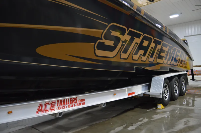 Slide: The Image of 2017 Statement 380 Open boat on Ace Trailers, indoor setting. - 3