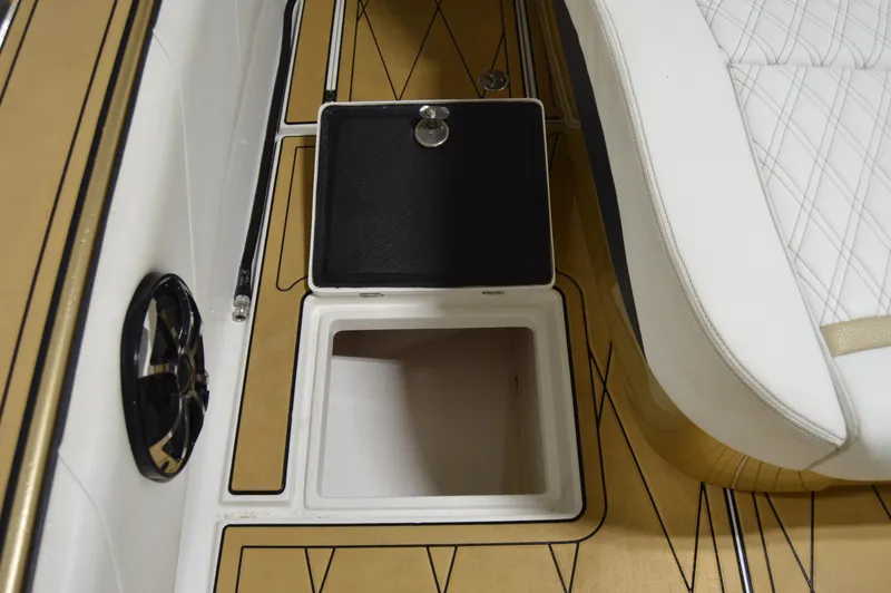 Slide: The Image of 2017 Statement 380 Open boat interior with storage compartment and speaker. - 33