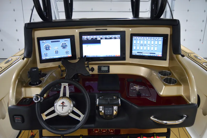 Slide: The Image of Helm of 2017 Statement 380 Open boat with advanced navigation displays and controls. - 39