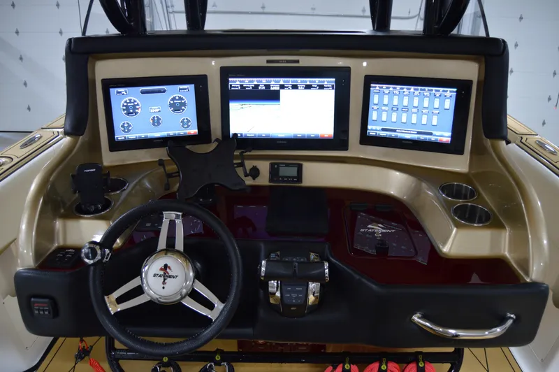 Slide: The Image of Control panel of 2017 Statement 380 Open boat with multiple screens and steering wheel. - 42