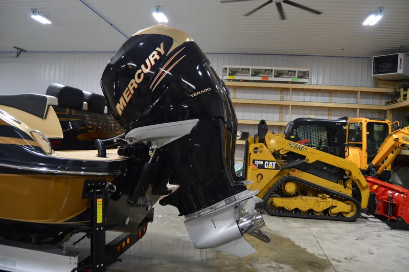 Slide: The Image of 2017 Statement 380 Open boat with Mercury outboard engine in a garage. - 6